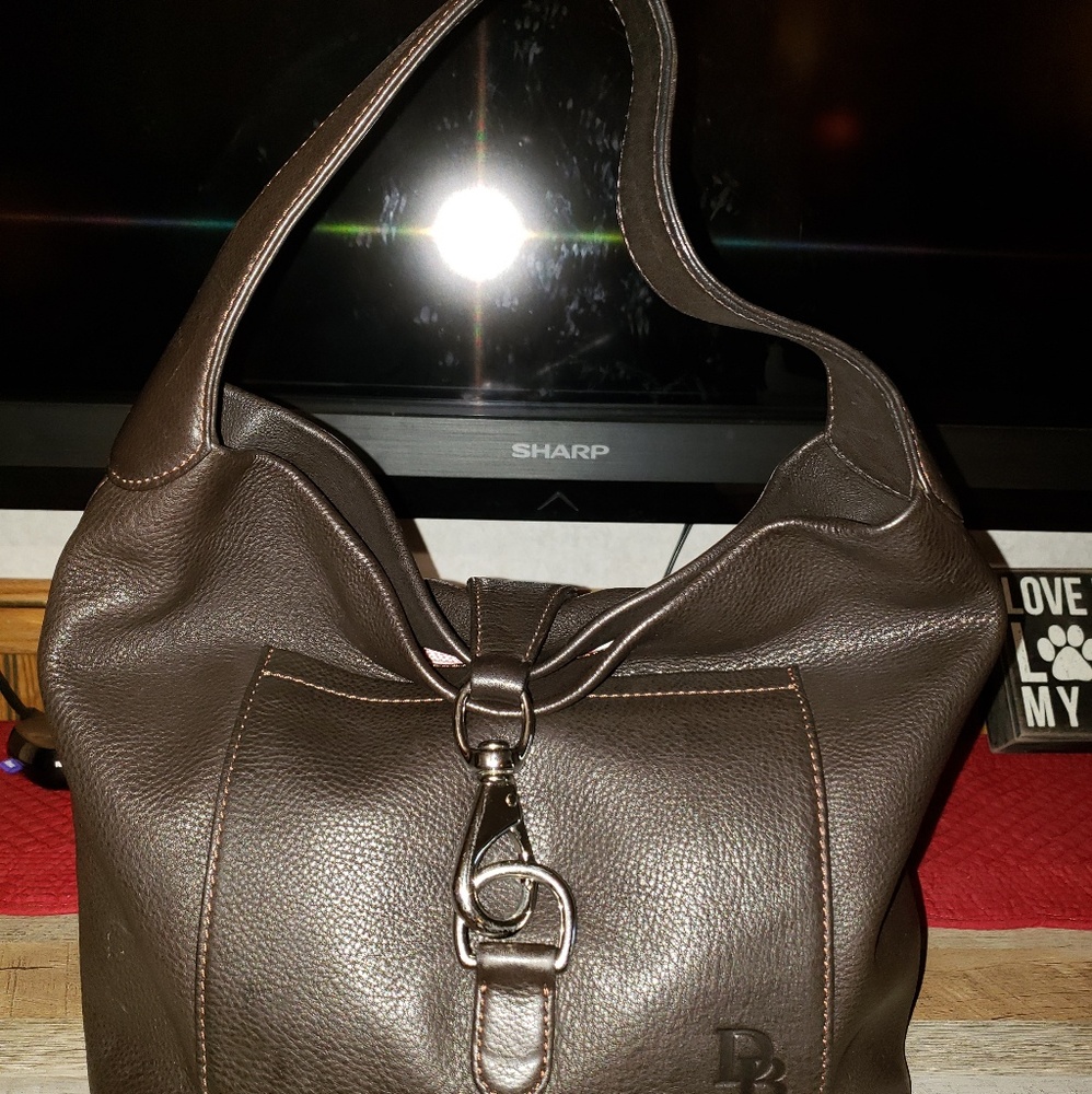 Sold...Dooney and Bourke small lock